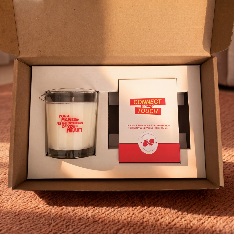 Massage Oil Candle and Deck of Cards Connect Through Touch placed inside a box. 